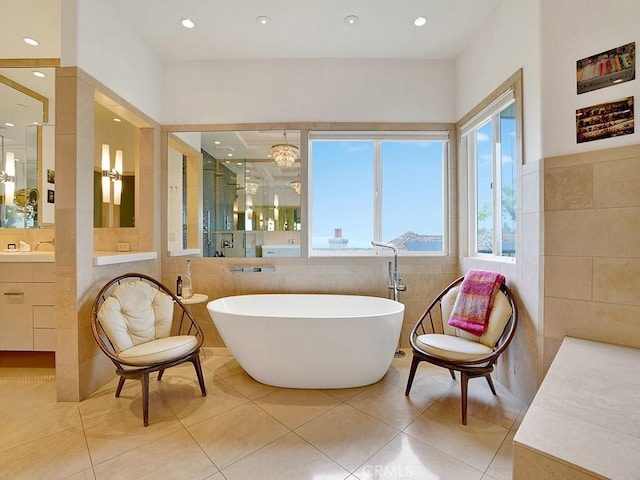 508 Lantern Crest Dr, Redlands, CA 92373 - full bath with tile patterned floors, tile walls, and a freestanding tub