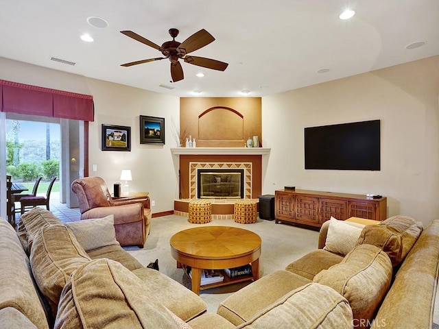 508 Lantern Crest Dr, Redlands, CA 92373 - carpeted living area with visible vents, baseboards, ceiling fan, recessed lighting, and a tile fireplace