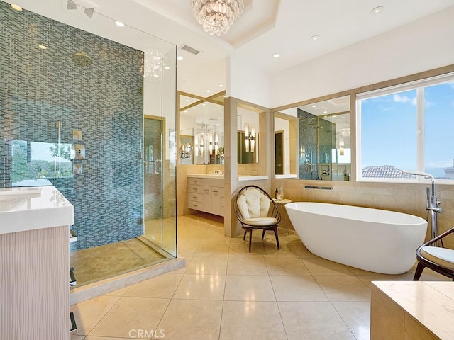 508 Lantern Crest Dr, Redlands, CA 92373 - bathroom with a shower stall, vanity, tile patterned floors, a notable chandelier, and a soaking tub