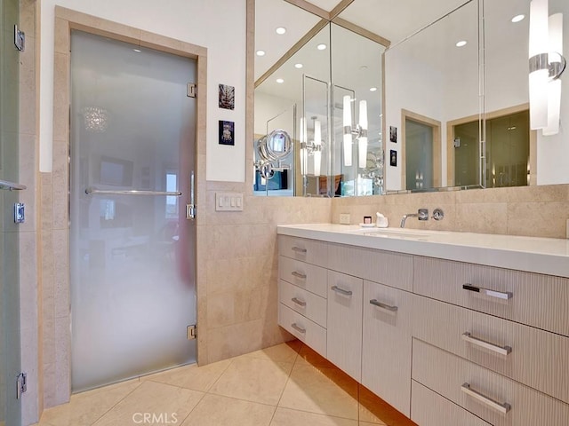 508 Lantern Crest Dr, Redlands, CA 92373 - bathroom with tile walls, a shower stall, tile patterned flooring, and vanity