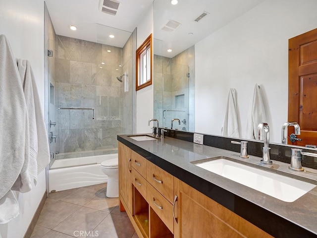 508 Lantern Crest Dr, Redlands, CA 92373 - bathroom featuring visible vents, combined bath / shower with glass door, a sink, and tile patterned flooring