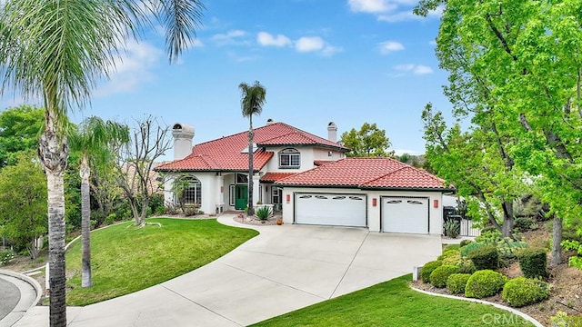 508 Lantern Crest Dr, Redlands, CA 92373 - mediterranean / spanish home with an attached garage, a chimney, stucco siding, and a tiled roof