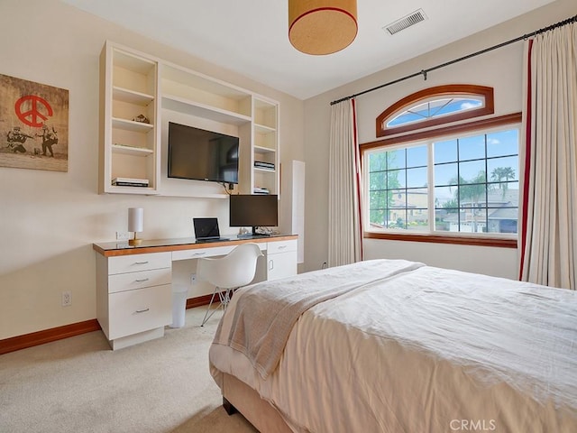 508 Lantern Crest Dr, Redlands, CA 92373 - bedroom with visible vents, baseboards, built in desk, and light colored carpet
