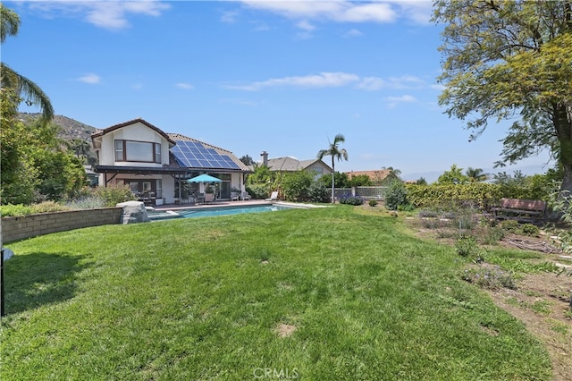 view of yard featuring a patio area and an outdoor pool