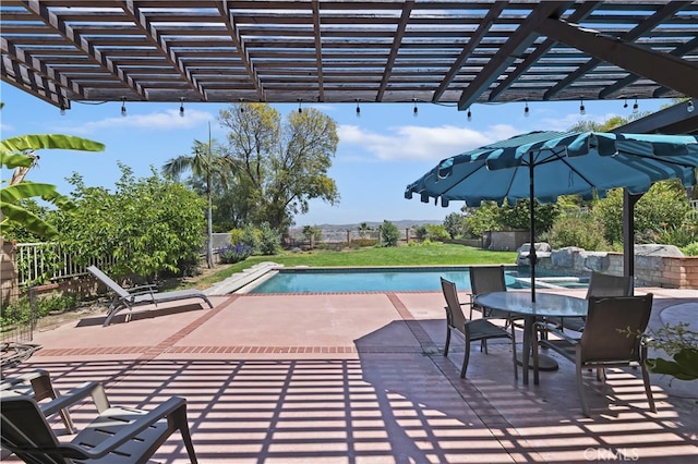 view of patio / terrace featuring fence, a pergola, and an outdoor pool