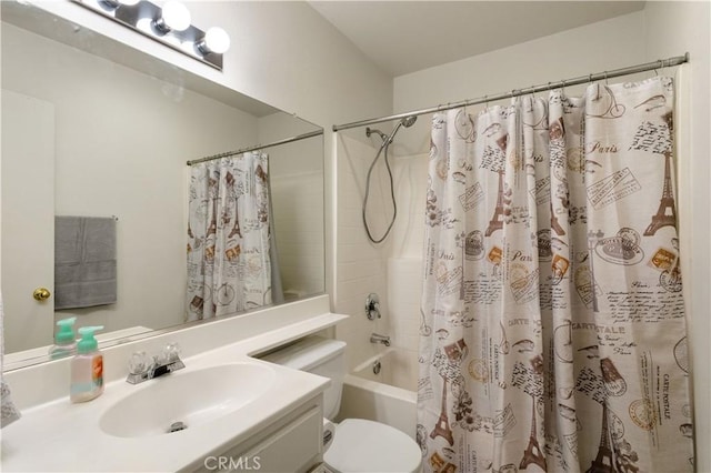 bathroom featuring vanity, shower / bath combination with curtain, and toilet