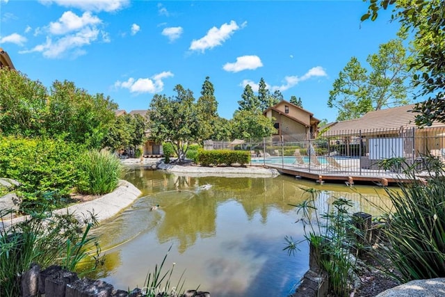 dock area featuring a fenced in pool and fence
