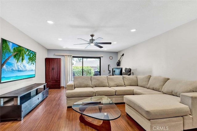 living area featuring a ceiling fan, recessed lighting, and wood finished floors