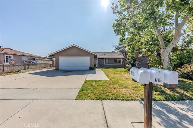 ranch-style house featuring a garage, fence, a front yard, stucco siding, and concrete driveway