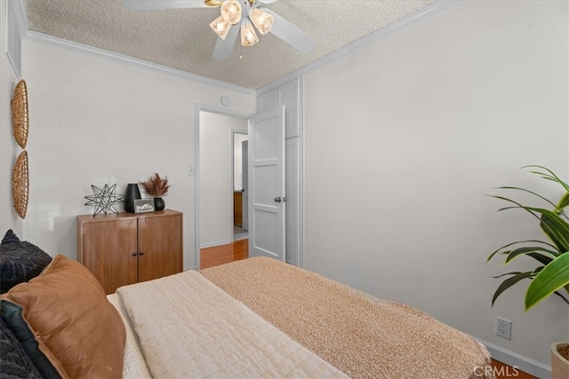 8212 Reading Ave, Los Angeles, CA 90045 - bedroom featuring a textured ceiling, wood finished floors, crown molding, baseboards, and ceiling fan