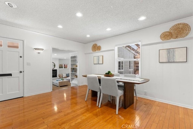 8212 Reading Ave, Los Angeles, CA 90045 - dining space with a textured ceiling, light wood-style floors, baseboards, and recessed lighting