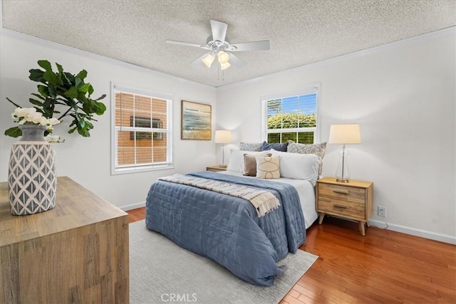 8212 Reading Ave, Los Angeles, CA 90045 - bedroom featuring a textured ceiling, ornamental molding, wood finished floors, baseboards, and a ceiling fan
