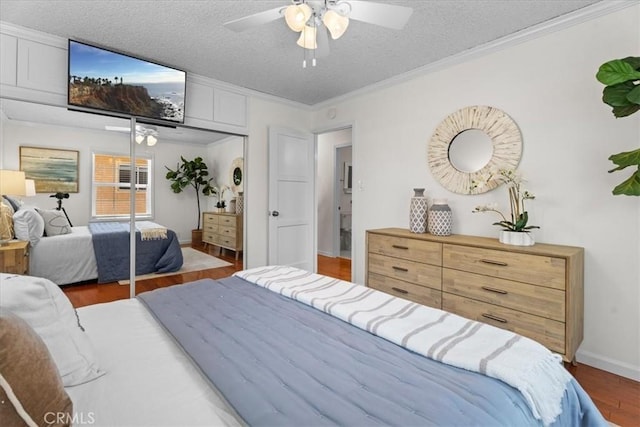 8212 Reading Ave, Los Angeles, CA 90045 - bedroom with wood finished floors, a closet, ornamental molding, a textured ceiling, and a ceiling fan