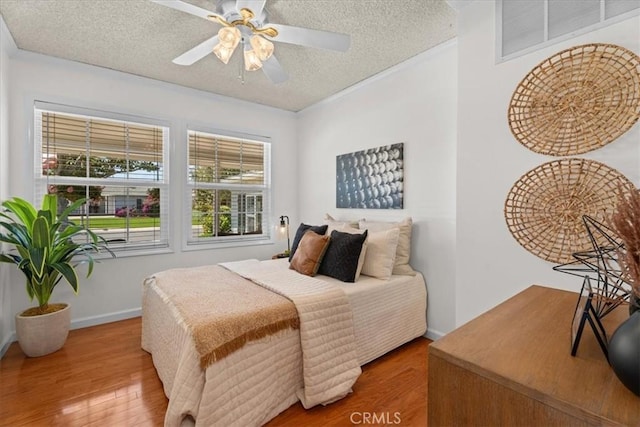 8212 Reading Ave, Los Angeles, CA 90045 - bedroom featuring a textured ceiling, wood finished floors, ceiling fan, and baseboards