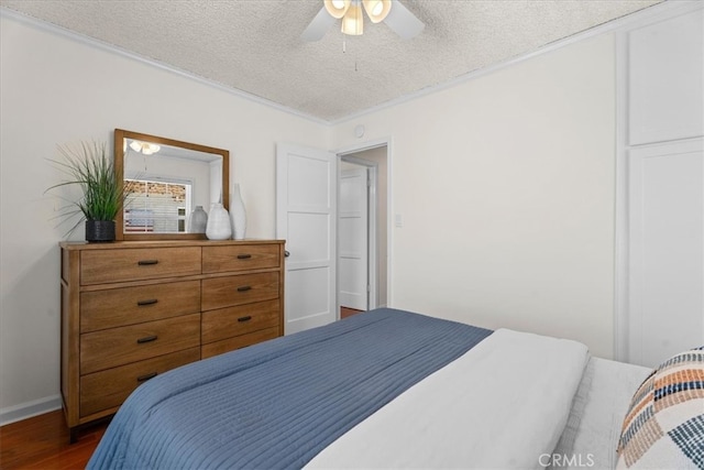 8212 Reading Ave, Los Angeles, CA 90045 - bedroom with dark wood-style flooring, a textured ceiling, ceiling fan, baseboards, and ornamental molding