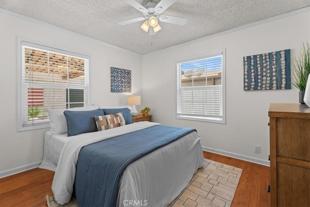8212 Reading Ave, Los Angeles, CA 90045 - bedroom with light wood-type flooring, a textured ceiling, baseboards, and a ceiling fan