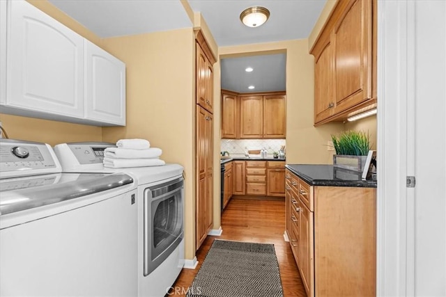 8212 Reading Ave, Los Angeles, CA 90045 - laundry area featuring cabinet space, independent washer and dryer, wood finished floors, and recessed lighting