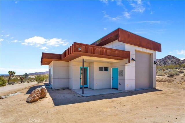exterior space featuring a mountain view and a garage
