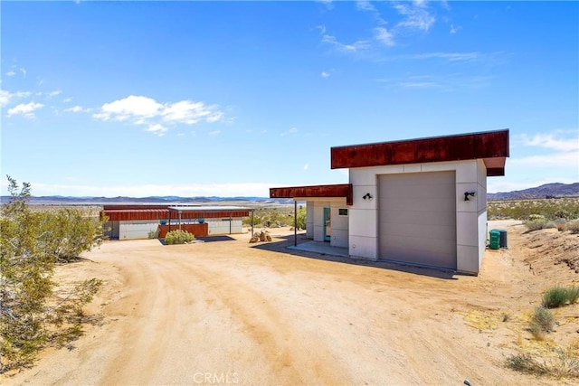 64172 Hollinger Rd, Joshua Tree, CA 92252 - detached garage featuring a mountain view and cooling unit