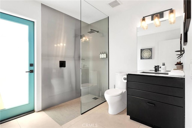 64172 Hollinger Rd, Joshua Tree, CA 92252 - full bathroom featuring toilet, walk in shower, vanity, and tile patterned floors
