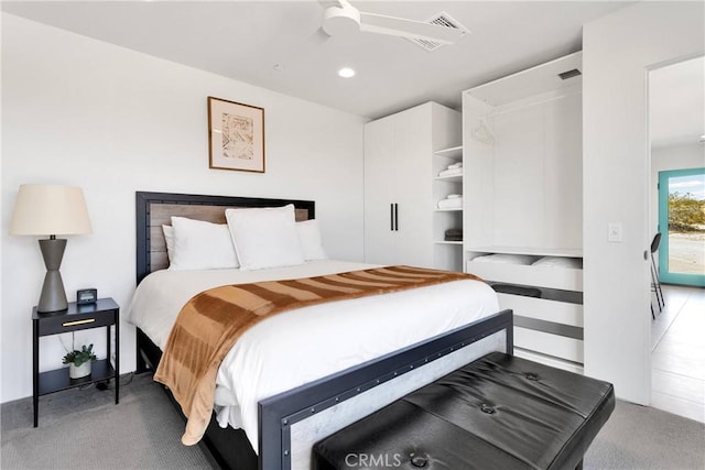 carpeted bedroom featuring ceiling fan, recessed lighting, and visible vents