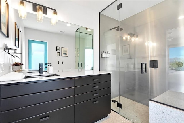 64172 Hollinger Rd, Joshua Tree, CA 92252 - full bathroom with vanity, a stall shower, and speckled floor
