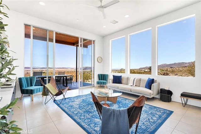 living room featuring visible vents, a ceiling fan, light tile patterned floors, and recessed lighting