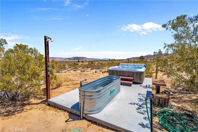 64172 Hollinger Rd, Joshua Tree, CA 92252 - view of yard with a hot tub and a mountain view