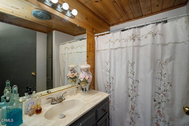 full bath with wood ceiling, vanity, and curtained shower