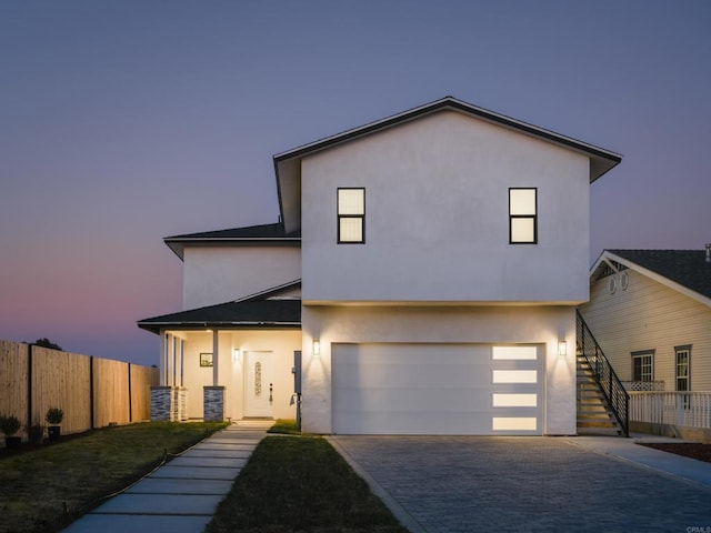 113 2nd Ave, Chula Vista, CA 91910 - contemporary house with a garage, fence, stairs, and stucco siding