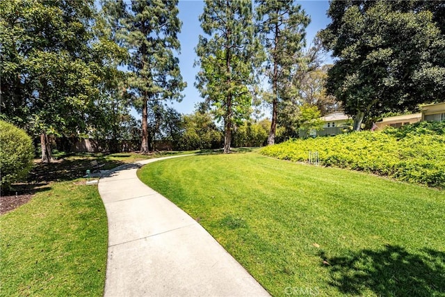 76 Calle Aragon Unit Q, Laguna Woods, CA 92637 - surrounding community featuring a lawn