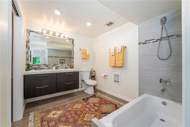 76 Calle Aragon Unit Q, Laguna Woods, CA 92637 - full bathroom featuring vanity, heating unit, baseboards, wood finished floors, and recessed lighting