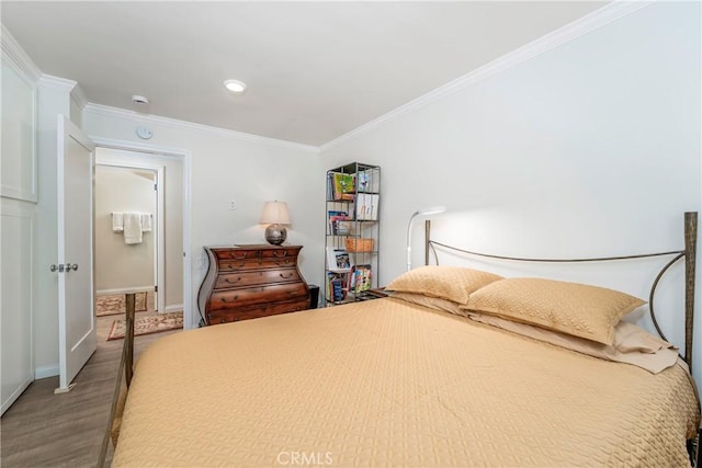 76 Calle Aragon Unit Q, Laguna Woods, CA 92637 - bedroom with crown molding, baseboards, and wood finished floors