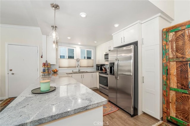 76 Calle Aragon Unit Q, Laguna Woods, CA 92637 - kitchen featuring appliances with stainless steel finishes, white cabinetry, a sink, light stone counters, and recessed lighting