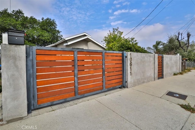 view of gate featuring fence