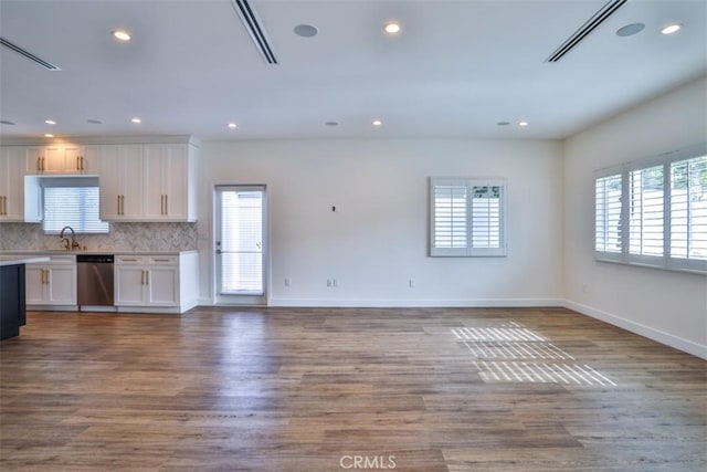 kitchen featuring plenty of natural light, open floor plan, and dishwasher