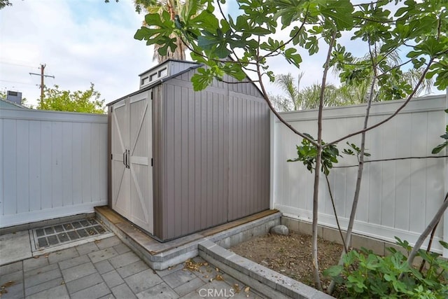view of shed with a fenced backyard