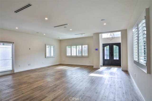 foyer featuring recessed lighting, french doors, visible vents, and wood finished floors