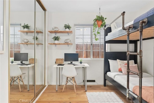 bedroom with wood finished floors
