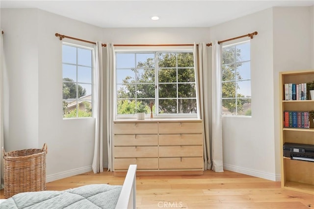 bedroom featuring baseboards, recessed lighting, and light wood-style flooring