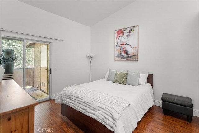 bedroom with baseboards, lofted ceiling, wood finished floors, and access to exterior