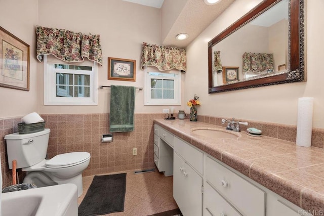 1704 Winterwarm Dr, Fallbrook, CA 92028 - bathroom with tile walls, a wainscoted wall, vanity, and a bidet