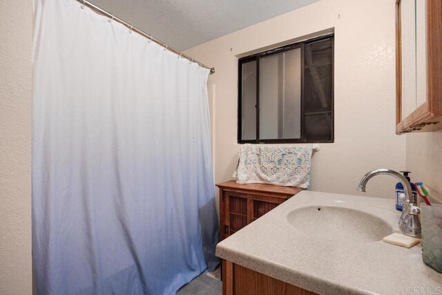 1704 Winterwarm Dr, Fallbrook, CA 92028 - full bath featuring vanity and a shower with shower curtain