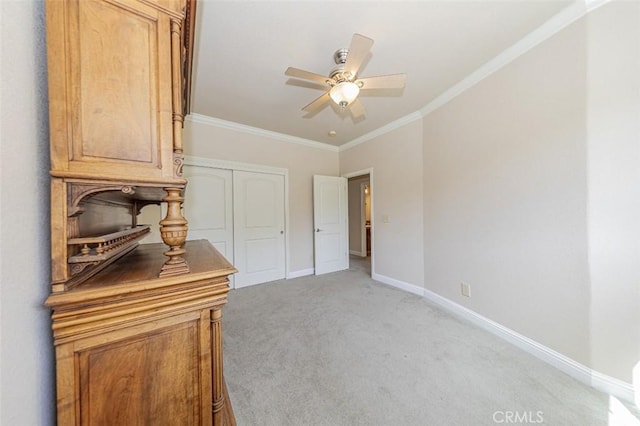 30840 Badger Ct, Coarsegold, CA 93614 - bedroom with a closet, crown molding, baseboards, ceiling fan, and light carpet