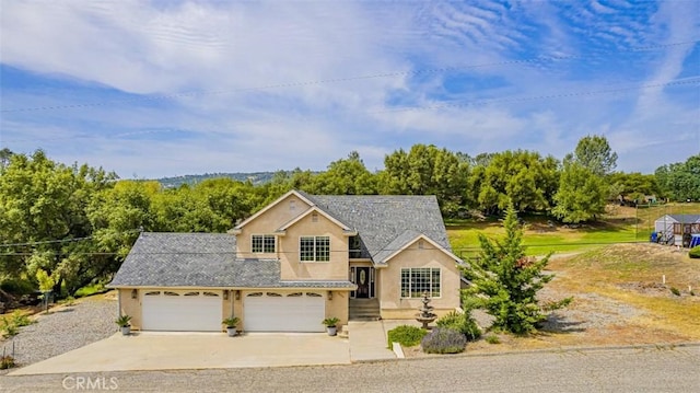 30840 Badger Ct, Coarsegold, CA 93614 - view of front of property featuring concrete driveway and stucco siding