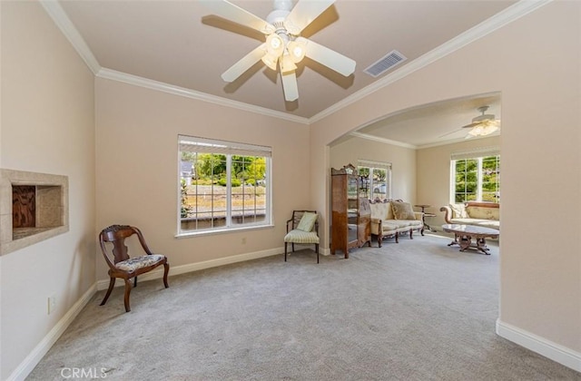 30840 Badger Ct, Coarsegold, CA 93614 - living area featuring carpet flooring, a ceiling fan, crown molding, visible vents, and arched walkways