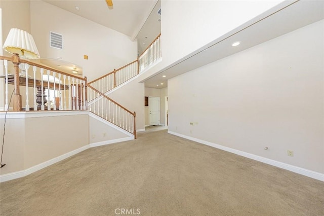 30840 Badger Ct, Coarsegold, CA 93614 - unfurnished living room featuring stairway, carpet, baseboards, and visible vents