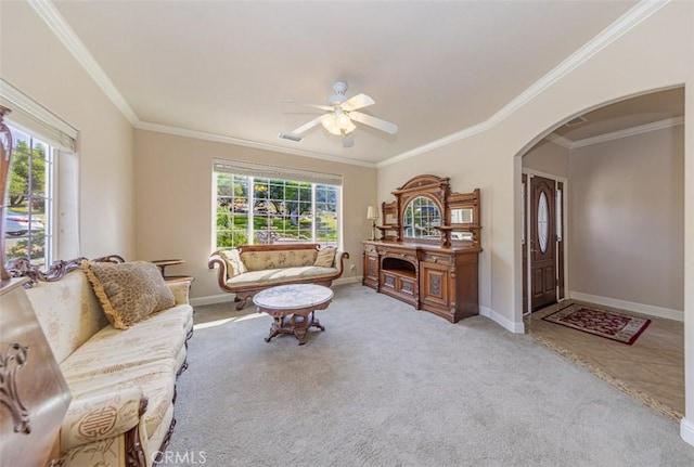 30840 Badger Ct, Coarsegold, CA 93614 - living room with carpet floors, ornamental molding, baseboards, ceiling fan, and arched walkways