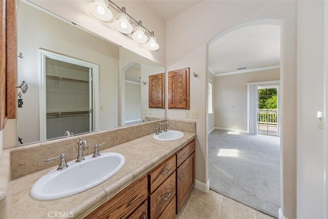 30840 Badger Ct, Coarsegold, CA 93614 - bathroom with a sink, tile patterned floors, baseboards, and double vanity