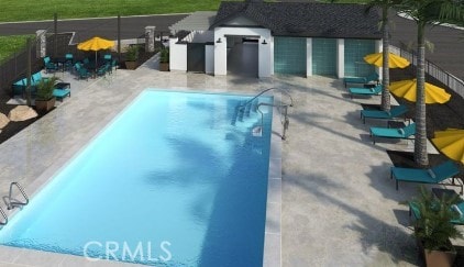 pool featuring a patio and fence
